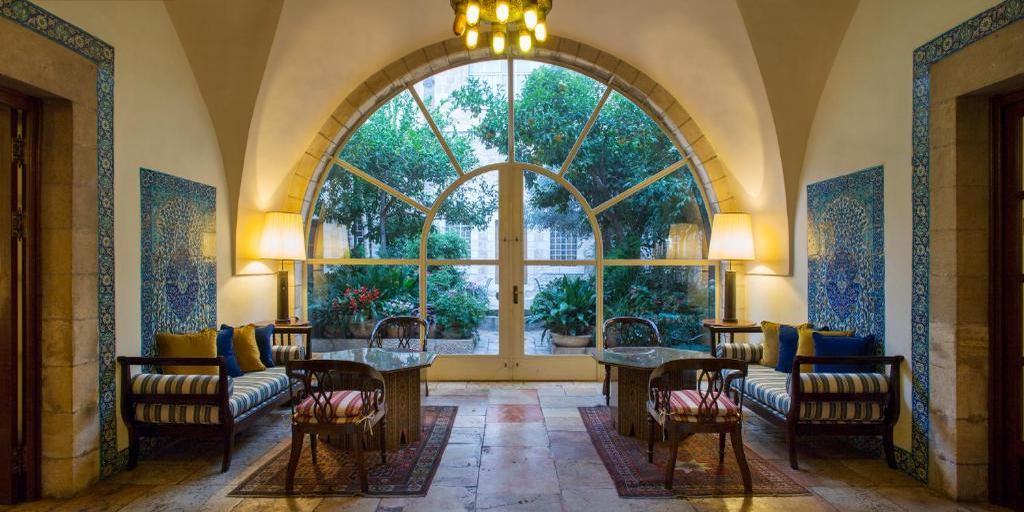 A vaulted sitting room at the American Colony Hotel looking out onto the courtyard